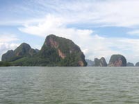 The limestone outcrops rise dramatically from the sea in Phang Nga Bay